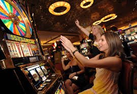 Slot game interface showing reels, paylines, and stake controls on naga69